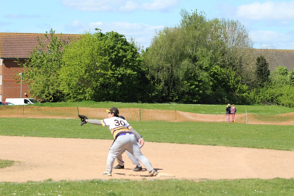 Fielder reaching to make a play at a base